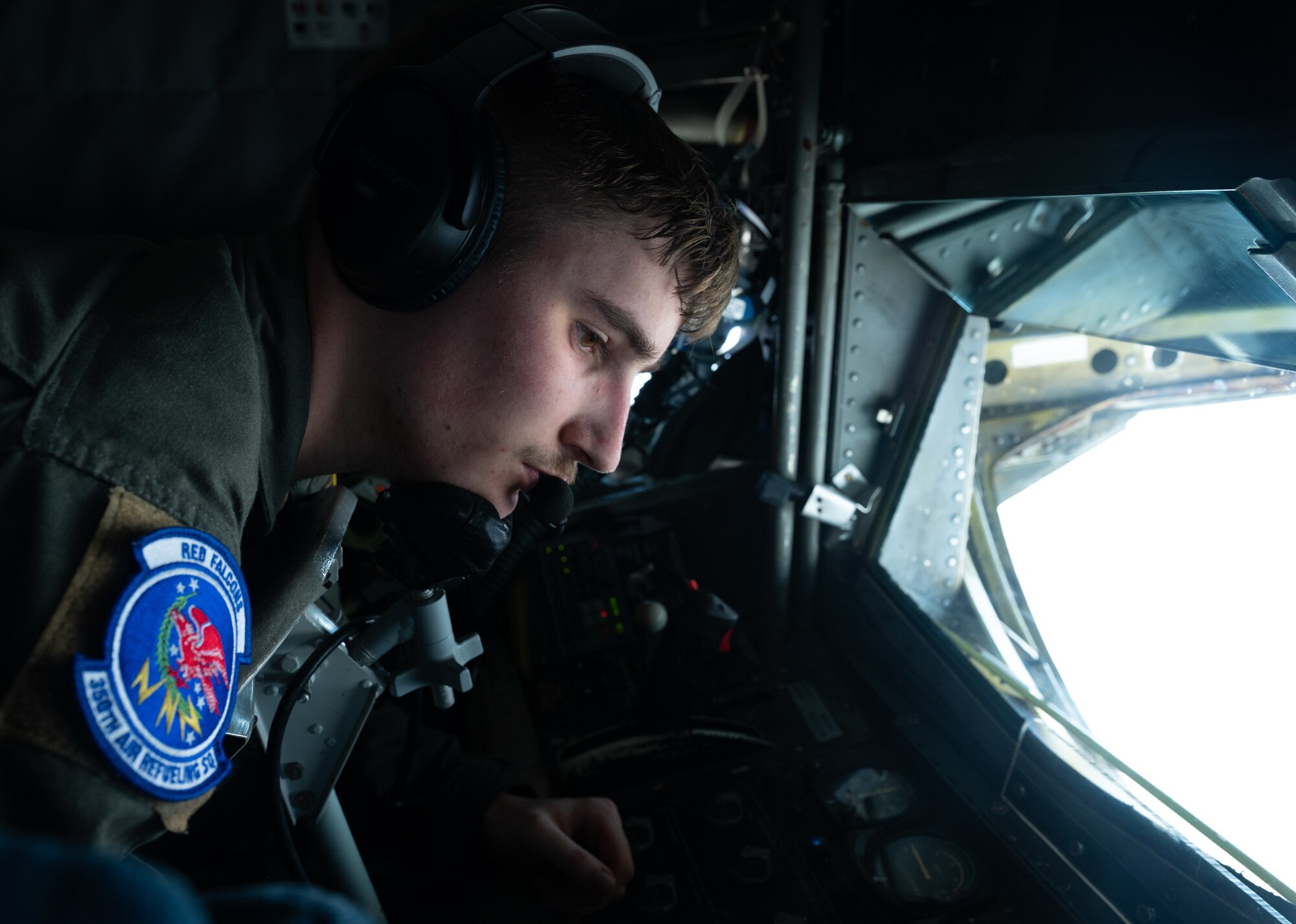 Airman 1st Class Cody Rommes, 350th Air Refueling Squadron KC-135 Stratotanker aircraft boom operator, refuels an F-35 Lightning II aircraft assigned to the 176th Fighter Squadron, Wisconsin Air National Guard, over the Pacific Ocean, July 11, 2025. This flight mission is part of the U.S. Air Force's 2025 Department-Level Exercise series, designed to strengthen and showcase its ability to operate at speed and scale, sustain prolonged operations, and rapidly shift across any theater. The DLE series encompasses all branches of the Department of Defense, along with Allies and partners, employing more than 400 joint and coalition aircraft and more than 12,000 personnel across more than 50 locations across 3,000 miles. (U.S. Air Force photo by Staff Sgt. Tryphena Mayhugh)