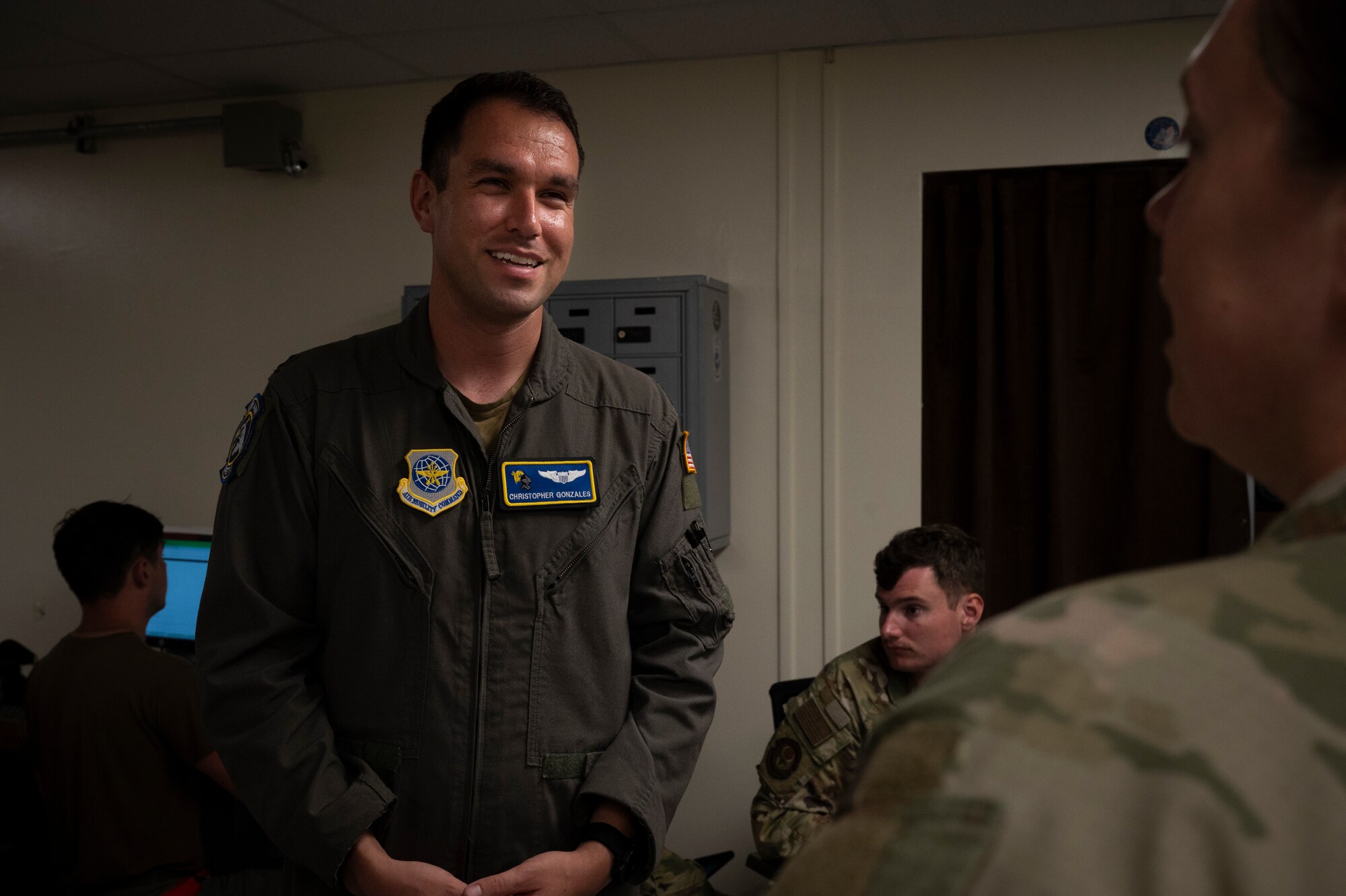 U.S. Air Force Capt. Christopher Gonzales, 19th Airlift Wing chief of flight safety, and Senior Master Sgt. Chelsie Suggs, 19th Aircraft Maintenance Squadron senior enlisted leader, both assigned to the 19th AW, discuss aircraft preparations at Andersen Air Force Base, Guam, during the Air Force’s 2025 Department-Level Exercise series, July 23, 2025. Air Mobility Command safety personnel ensured mission readiness by identifying hazards and mitigating risks for Airmen during the DLE. The DLE series encompasses all branches of the Department of Defense, along with allies and partners, employing more than 400 Joint and coalition aircraft and more than 12,000 members at more than 50 locations across 3,000 miles. (U.S. Air Force photo by Staff Sgt. Dalton Williams)