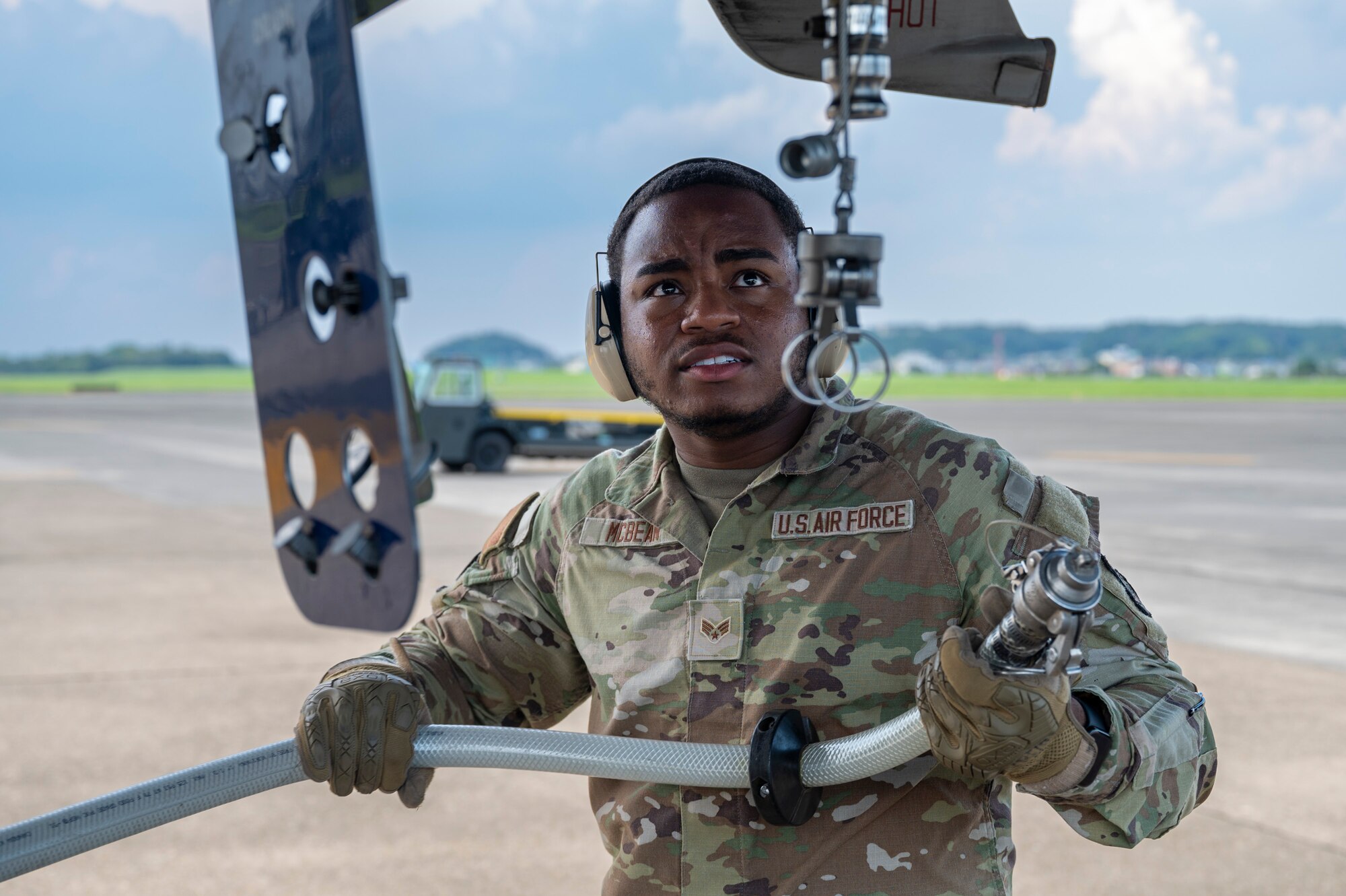 U.S. Air Force Senior Airman Tyric McBean, an air transportation specialist assigned to the 730th Air Mobility Squadron, provides potable water to a Boeing 767 passenger aircraft in support of Resolute Force Pacific 2025 at Yokota Air Base, Japan, July 24, 2025. The 730th AMS Fleet Services team ensures military and commercial aircraft are mission-ready by stocking essential supplies, removing waste, and servicing lavatories. REFORPAC is part of the first-in-a-generation Department-Level Exercise series, a new way of conducting operations in a contested, dynamic environment to build capabilities making a stronger, more deterrent force. The DLE encompasses all branches of the Department of Defense, Allies, and partners, employing over 400 joint and coalition aircraft and more than 12,000 personnel across more than 50 locations spanning 3,000 miles.  (U.S. Air Force photo by Airman 1st Class Samantha Thorn)