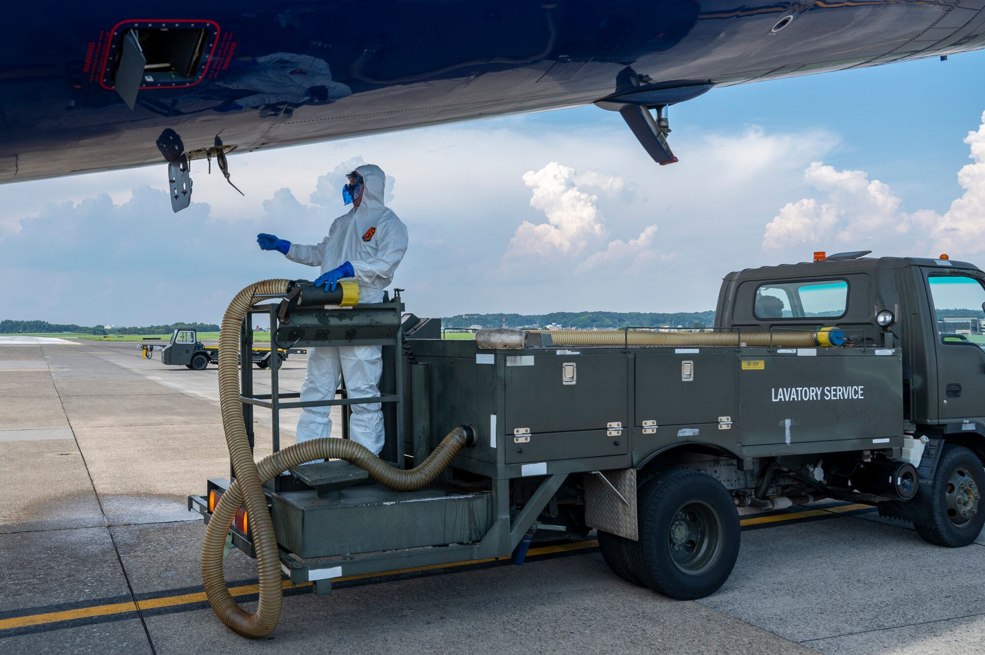 U.S. Air Force Airman 1st Class Benjamin Brenner, an air freight technician assigned to the 730th Air Mobility Squadron, services the lavatory of a Boeing 767 passenger aircraft in support of Resolute Force Pacific 2025 at Yokota Air Base, Japan, July 24, 2025. The 730th AMS Fleet Services team ensures military and commercial aircraft are fully mission-ready by stocking essential supplies, removing waste, and cleaning lavatories. REFORPAC is part of the first-in-a-generation Department-Level Exercise series, a new way of conducting operations in a contested, dynamic environment to build capabilities making a stronger, more deterrent force. The DLE encompasses all branches of the Department of Defense, Allies, and partners, employing over 400 joint and coalition aircraft and more than 12,000 personnel across more than 50 locations spanning 3,000 miles. (U.S. Air Force photo by Airman 1st Class Samantha Thorn)