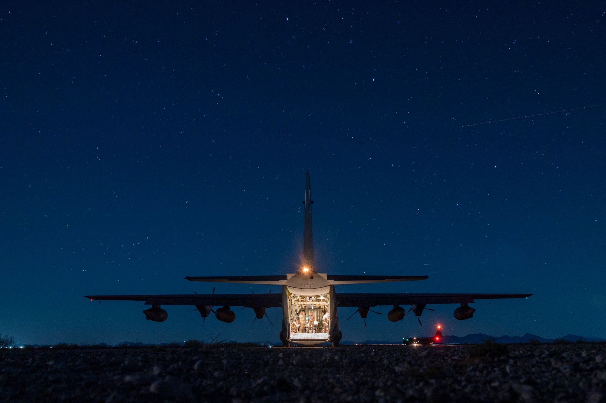 AFSOC Airmen conduct an Agile Combat Employment mission on a MC-130J Commando II during Emerald Warrior 25.2.