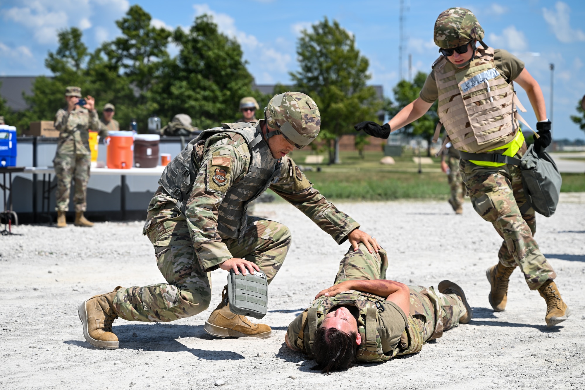 two medics attending a person laying down