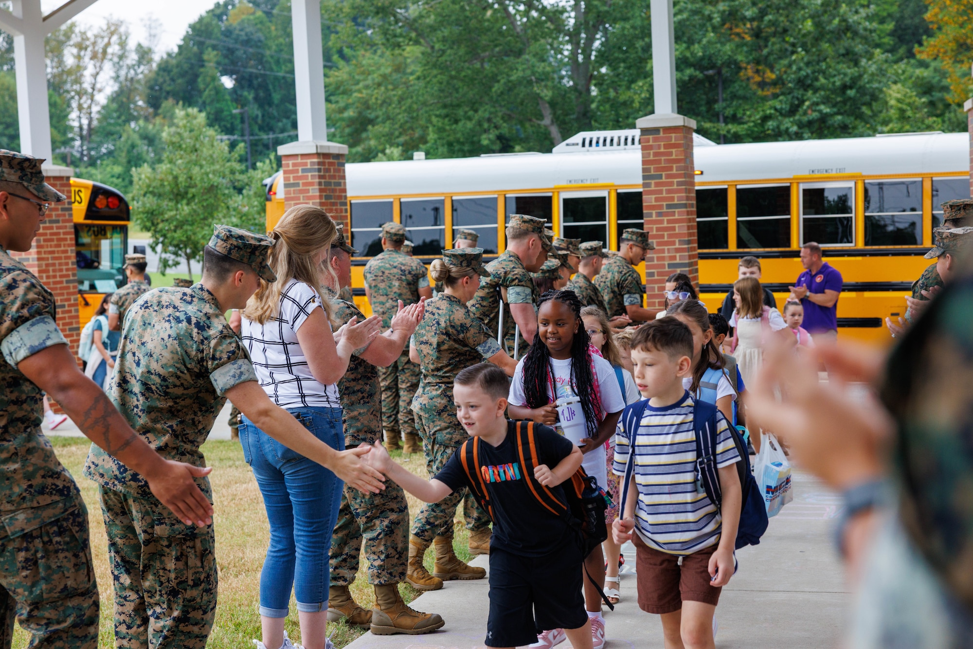 U.S. Marines and Crossroad Elementary School faculty welcome the students during a back-to-school celebration at the Crossroads Elementary School and Quantico Middle/High School on Marine Corps Base Quantico, Virginia, Aug. 18, 2025. This event welcomed students back to the classrooms, strengthening the bonds between the Marines and the MCB Quantico community. (U.S. Marine Corps video by Lance Cpl. Ethan Miller)