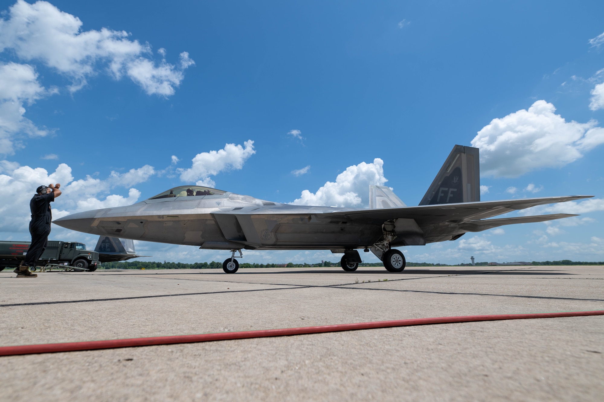 A plane taxis on a flightline
