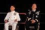 U.S. Central Command's (USCENTCOM) incoming commander, U.S. Navy Adm. Brad Cooper, left, and outgoing USCENTCOM outgoing commander, U.S. Army Gen. Michael Erik Kurilla, right, seated during a change of command ceremony, 8 August 2025. Multiple Department of Defense officials attended the event as well as distinguished defense leaders from partner nations around the world. (U.S. Central Command Public Affairs photo by Tom Gagnier)