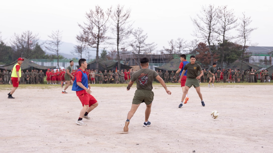 U.S. Marines with 2nd Battalion 2nd Battalion, 23rd Marines, forward deployed with 4th Marine Regiment, 3d Marine Division as part of the Unit Deployment Program, and Republic of Korea Marines with the 1st Marine Division, ROK Marine Corps, play a game of soccer during an end of exercise celebration competition as part of the Korean Marine Exercise Program 25.2 in Pohang, South Korea, Aug. 9, 2025. KMEP is conducted regularly between the ROK and U.S. Marine Corps to increase their combined capabilities through realistic training geared towards deterrence and maintaining peace in the Indo-Pacific.  (U.S. Marine Corps photo by Cpl. Kanoa Thomas)