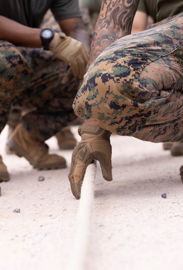 U.S. Marine Corps Sgt. Joshiwa Juni, a squad leader with 2nd Battalion, 23rd Marines, forward deployed with 4th Marine Regiment, 3d Marine Division as part of the Unit Deployment Program, grabs the rope before a tug of war match as part of an end of exercise celebration competition during the Korean Marine Exercise Program 25.2 in Pohang, South Korea, Aug. 9, 2025. KMEP is conducted regularly between the ROK and U.S. Marine Corps to increase their combined capabilities through realistic training geared towards deterrence and maintaining peace in the Indo-Pacific.  (U.S. Marine Corps photo by Cpl. Kanoa Thomas)