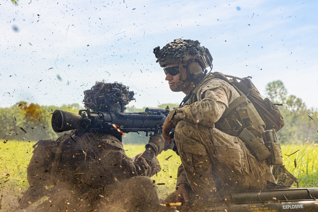 U.S. Marine Corps Cpl. Phillip Garcia, a rifleman and native of Texas, left, and 1st Lt. Michael Meo, a platoon commander and native of Oregon, both with 2nd Battalion, 2nd Marine Regiment, operate an M3 multi-role anti-armor anti-personnel weapon system during a live-fire exercise as part of a DFT, July 28, 2025. The ground and logistics combat elements of the Special Purpose Marine Air-Ground Task Force – Alert Contingency MAGTF (SPMAGTF-ACM), 2nd Battalion, 2nd Marines, and Combat Logistics Battalion 22, Combat Logistics Regiment 27, conducted a DFT to increase proficiency in comprehensive combat service support and improve overall combat readiness for any potential MAGTF missions. (U.S. Marine Corps photo by Lance Cpl. Jack Labrador)