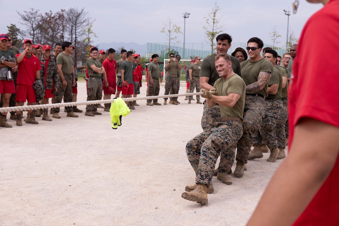 U.S. Marines with 2nd Battalion, 23rd Marines, forward deployed with 4th Marine Regiment, 3d Marine Division as part of the Unit Deployment Program, compete in a tug of war match as part of an end of exercise celebration competition during the Korean Marine Exercise Program 25.2 in Pohang, South Korea, Aug. 9, 2025. KMEP is conducted regularly between the ROK and U.S. Marine Corps to increase their combined capabilities through realistic training geared towards deterrence and maintaining peace in the Indo-Pacific.  (U.S. Marine Corps photo by Cpl. Kanoa Thomas)