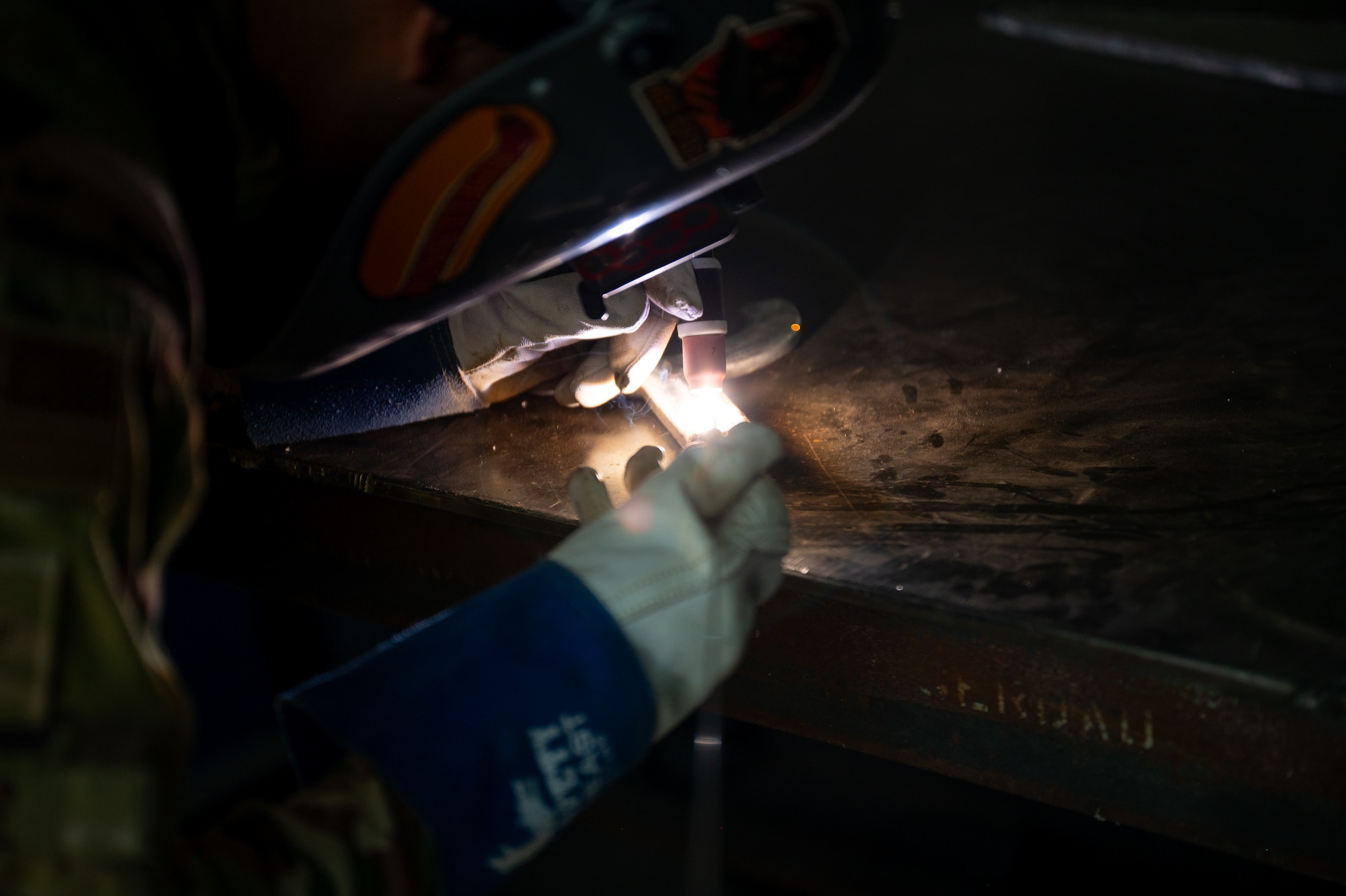 Airman welds an aluminum component
