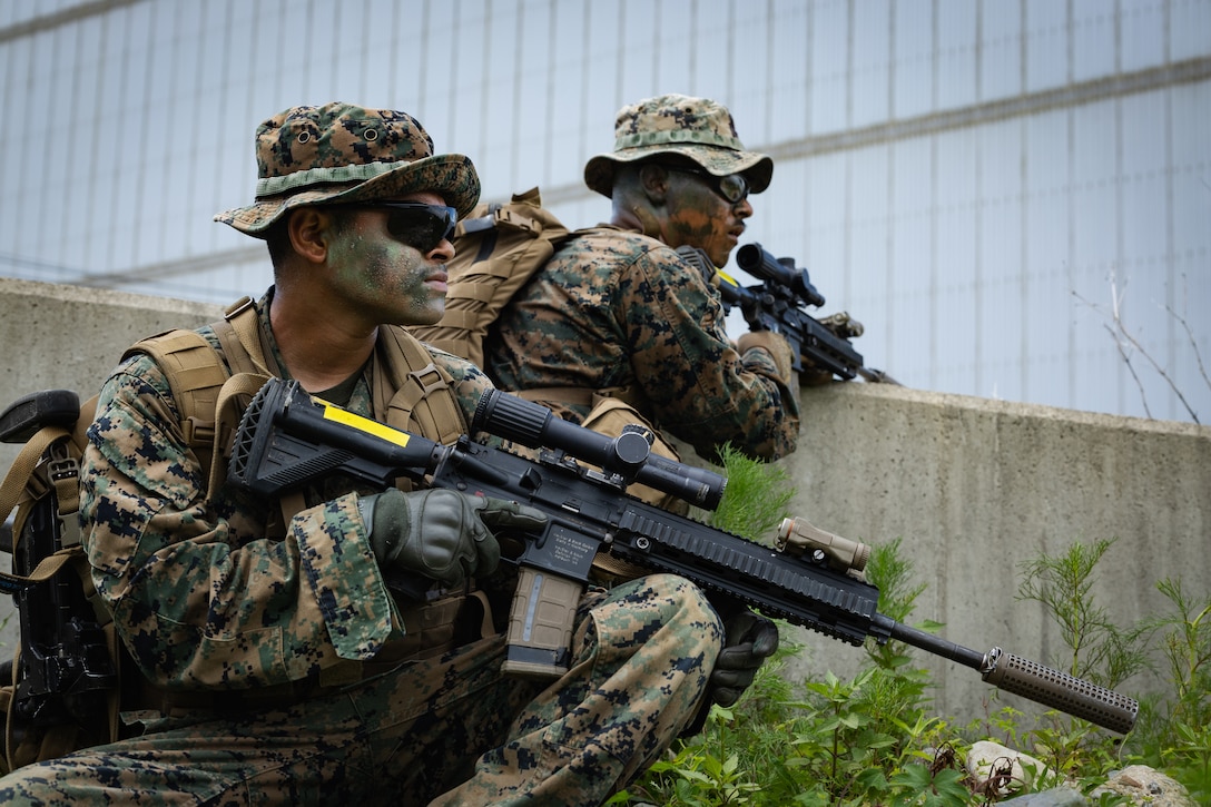 U.S. Marines with 2nd Battalion, 23rd Marines, forward deployed with 4th Marine Regiment, 3d Marine Division as part of the Unit Deployment Program, secure a crossroad to support the movement of follow-on reinforcements during the Korean Marine Exercise Program 25.2 in Pohang, South Korea, August 5, 2025. KMEP is conducted regularly between the ROK and U.S. Marine Corps to increase their combined capabilities through realistic training geared towards deterrence and maintaining peace in the Indo-Pacific. (U.S. Marine Corps photo by Lance Cpl. Van Hoang)