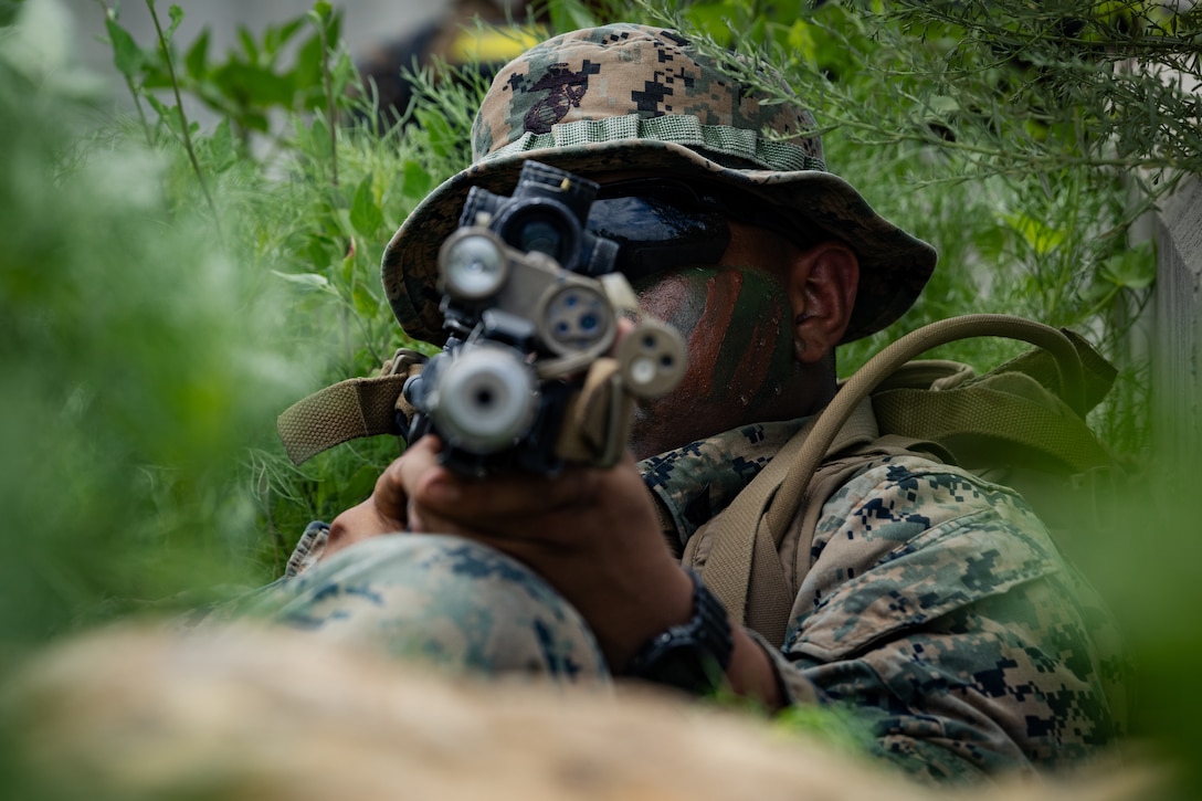 U.S. Marine Corps Cpl. Gabriel Moton, a rifleman with 2nd Battalion, 23rd Marines, forward deployed with 4th Marine Regiment, 3d Marine Division as part of the Unit Deployment Program, holds a line of fire overlooking an intersection during the Korean Marine Exercise Program 25.2 in Pohang, South Korea, August 5, 2025. KMEP is conducted regularly between the ROK and U.S. Marine Corps to increase their combined capabilities through realistic training geared towards deterrence and maintaining peace in the Indo-Pacific. (U.S. Marine Corps photo by Lance Cpl. Van Hoang)