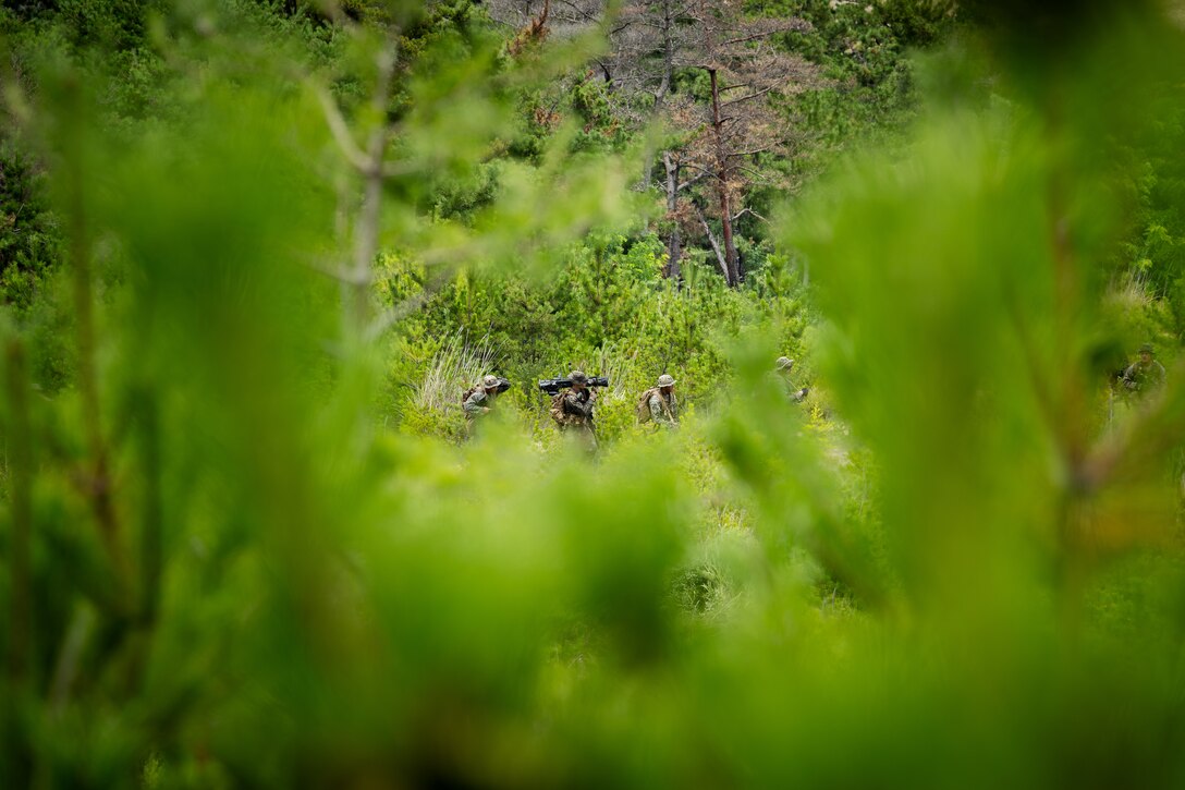 U.S. Marines with 2nd Battalion, 23rd Marines, forward deployed with 4th Marine Regiment, 3d Marine Division as part of the Unit Deployment Program, maneuver to a support-by-fire position before U.S. and Republic of Korea Marines assault a simulated enemy position during the Korean Marine Exercise Program 25.2 in Pohang, South Korea, August 5, 2025. KMEP is conducted regularly between the ROK and U.S. Marine Corps to increase their combined capabilities through realistic training geared towards deterrence and maintaining peace in the Indo-Pacific. (U.S. Marine Corps photo by Lance Cpl. Van Hoang)