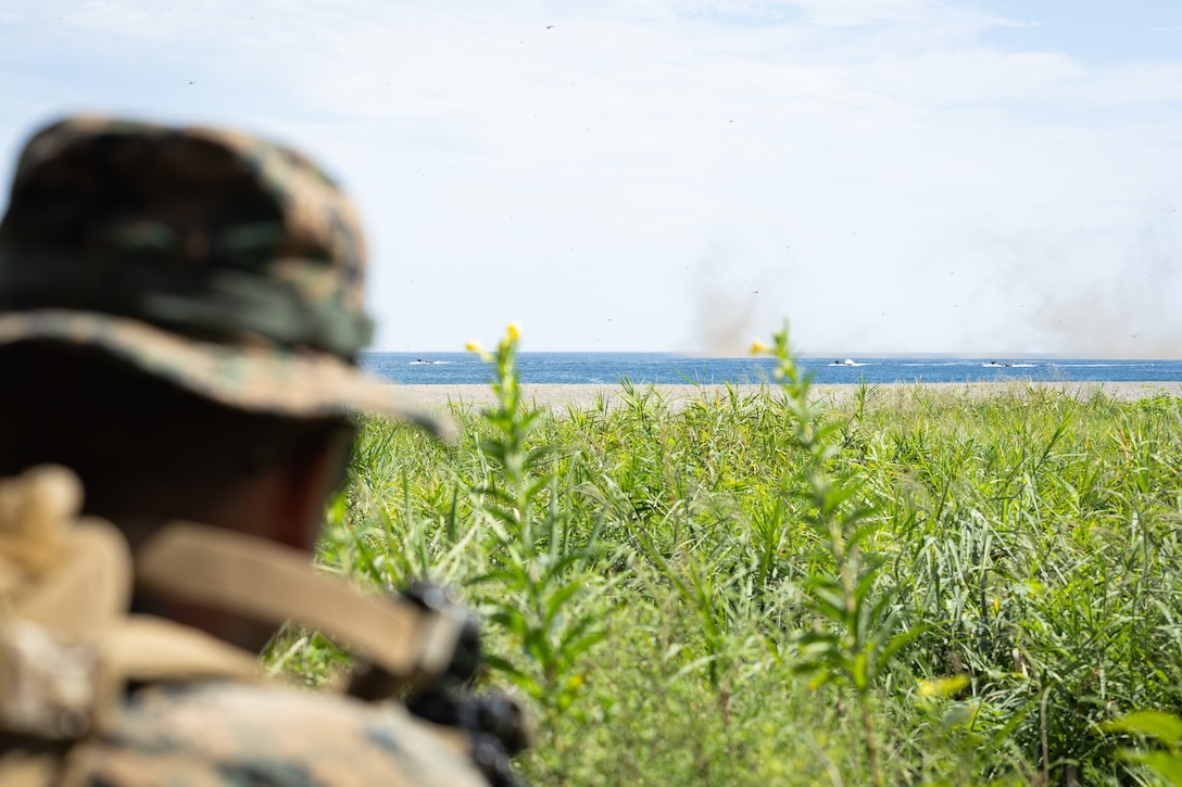 A U.S. Marine with 2nd Battalion, 23rd Marines, forward deployed with 4th Marine Regiment, 3d Marine Division as part of the Unit Deployment Program, clears a beachhead for Republic of Korea Marine Corps Amphibious Assault Vehicles to assault through during the Korean Marine Exercise Program 25.2 in Pohang, South Korea, August 5, 2025. KMEP is conducted regularly between the ROK and U.S. Marine Corps to increase their combined capabilities through realistic training geared towards deterrence and maintaining peace in the Indo-Pacific. (U.S. Marine Corps photo by Lance Cpl. Van Hoang)