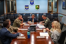 Team Minot leadership briefs North Dakota Sen. John Hoeven’s staff delegation at a conference table.