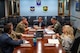 Team Minot leadership briefs North Dakota Sen. John Hoeven’s staff delegation at a conference table.