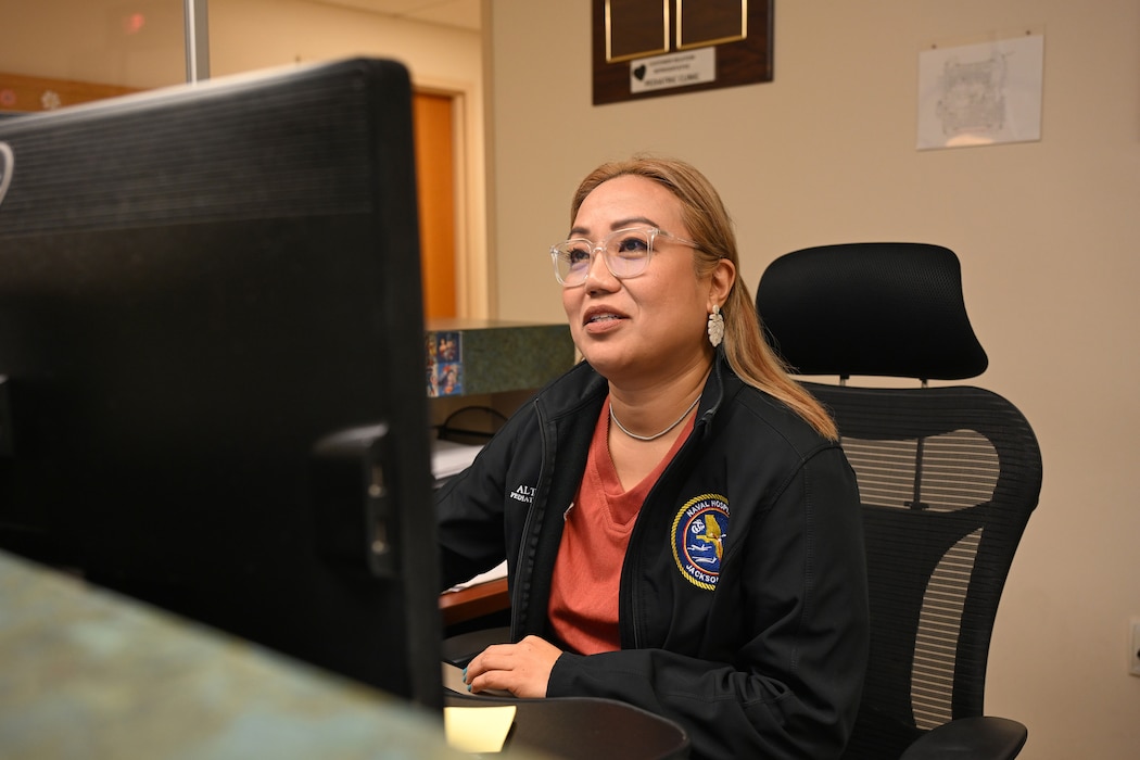 250814-N-FM959-1101 Jacksonville, FL. (August 14, 2025) Maria Altea Deros, front desk clerk at the pediatric department at Naval Hospital (NH) Jacksonville checks in a patient for an appointment. The pediatric staff at NH Jacksonville received the Best of the Best Award from the Defense Health Network Atlantic’s Joint Patient Experience Survey for Quarter 2, Fiscal Year 2025, with 96.4 percent beneficiary satisfaction. (U.S. Navy photo by Michael Campbell)