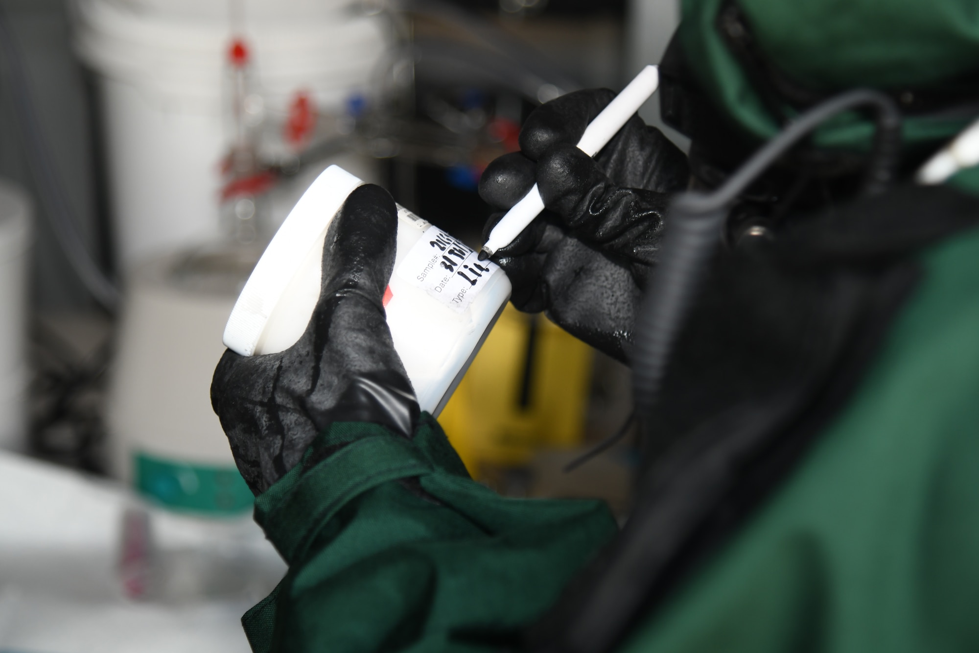 A member of the New Jersey National Guard’s 21st Weapons of Mass Destruction–Civil Support Team labels a sample container during a training exercise at Mercer County Park, West Windsor Township, New Jersey, July 31, 2025.