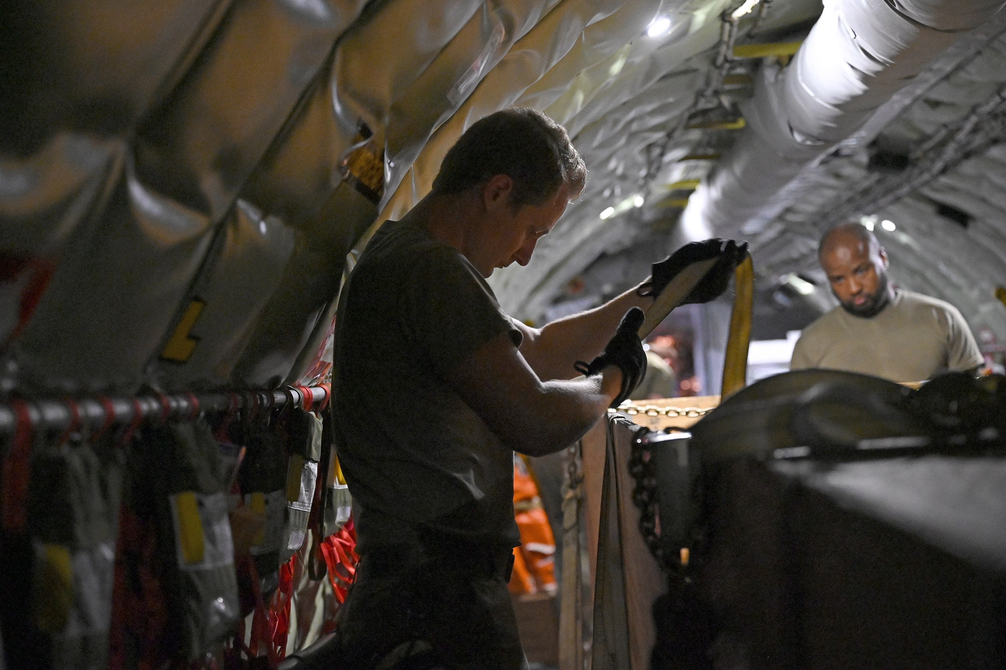 Airmen from the 434th AMXS configure the interior of a KC-135R Stratotanker