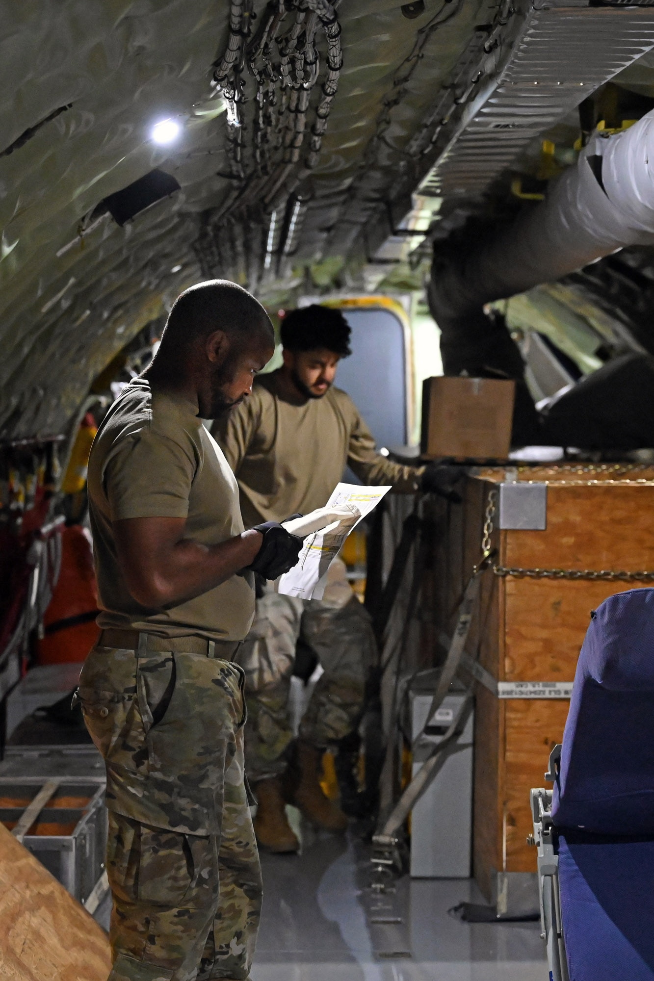 Airmen of the 434th Maintenance Squadron work to reconfigure the interior of a KC-135R Stratotanker