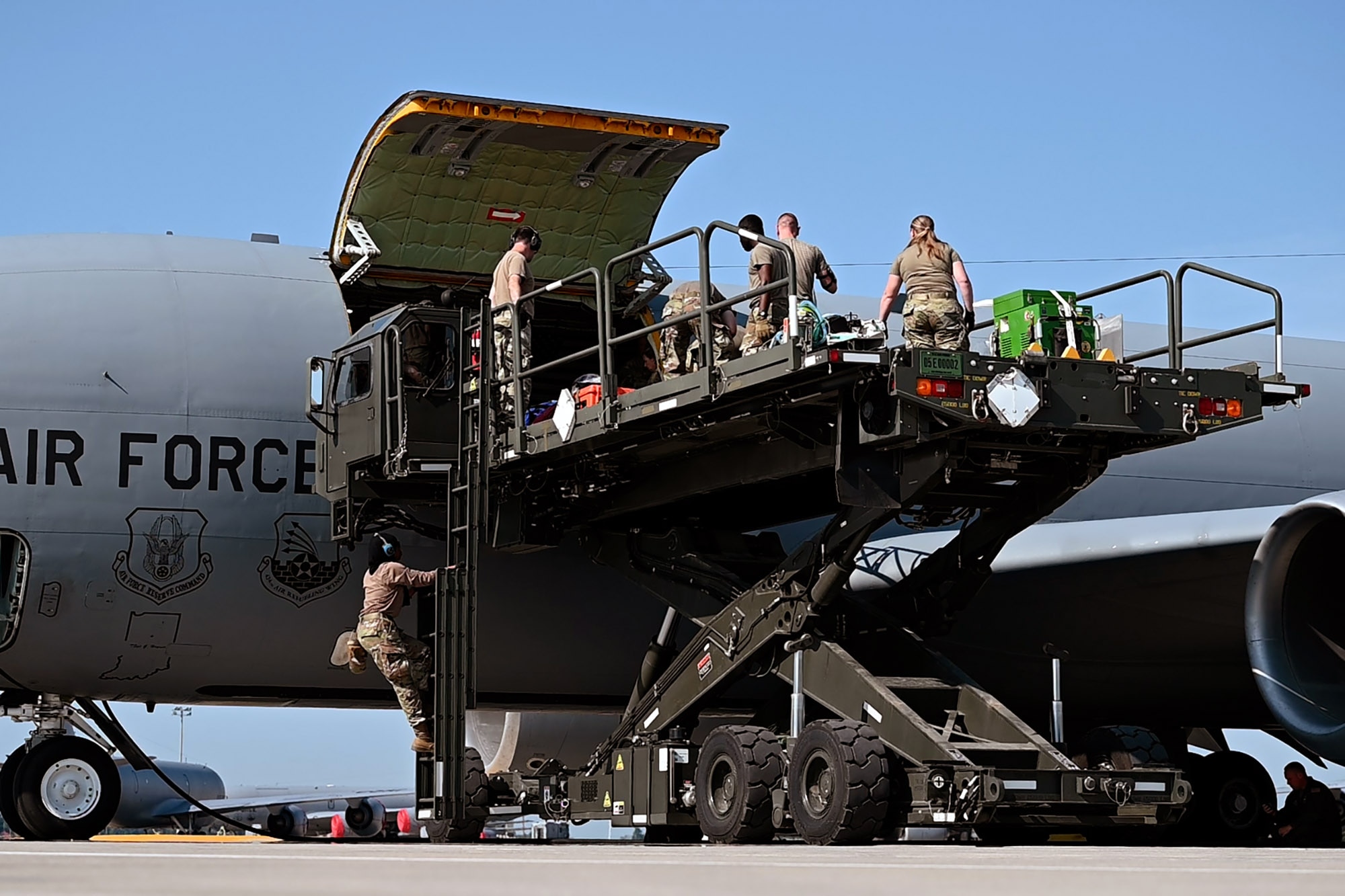Airmen participating in exercise Patriot Medic 25 load simulated casualties and medical equipment onto a KC-135R Stratotanker