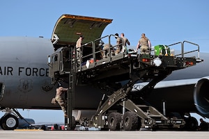 Airmen participating in exercise Patriot Medic 25 load simulated casualties and medical equipment onto a KC-135R Stratotanker
