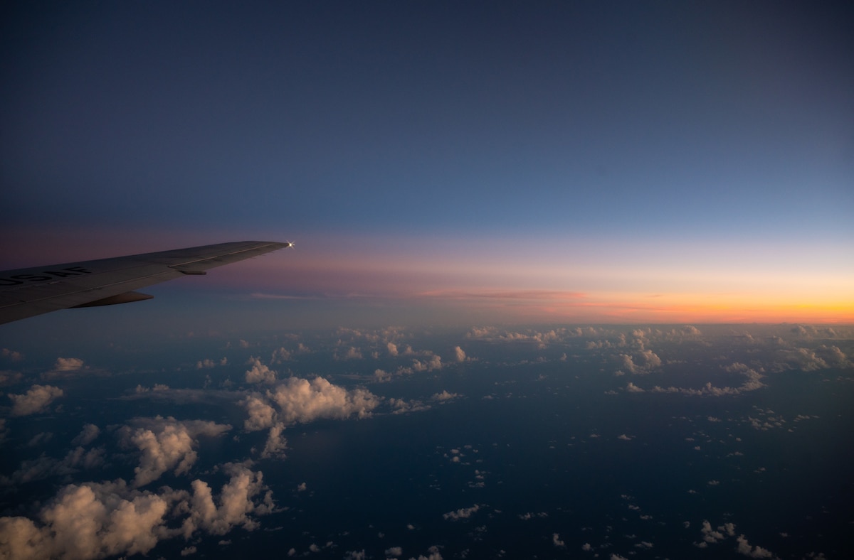 A KC-46A Pegasus operated by aircrew assigned to the 344th Air Refueling Squadron, McConnell Air Force Base, Kansas, flies over the Pacific Ocean at sunset July 27, 2025. The McConnell Airmen traveled to Hawaii and then California to participate in Exercise Bamboo Eagle 25-3, one of five exercises comprising the Department-Level Exercise series in the Indo-Pacific region. (U.S. Air Force photo by Staff Sgt. Tryphena Mayhugh)