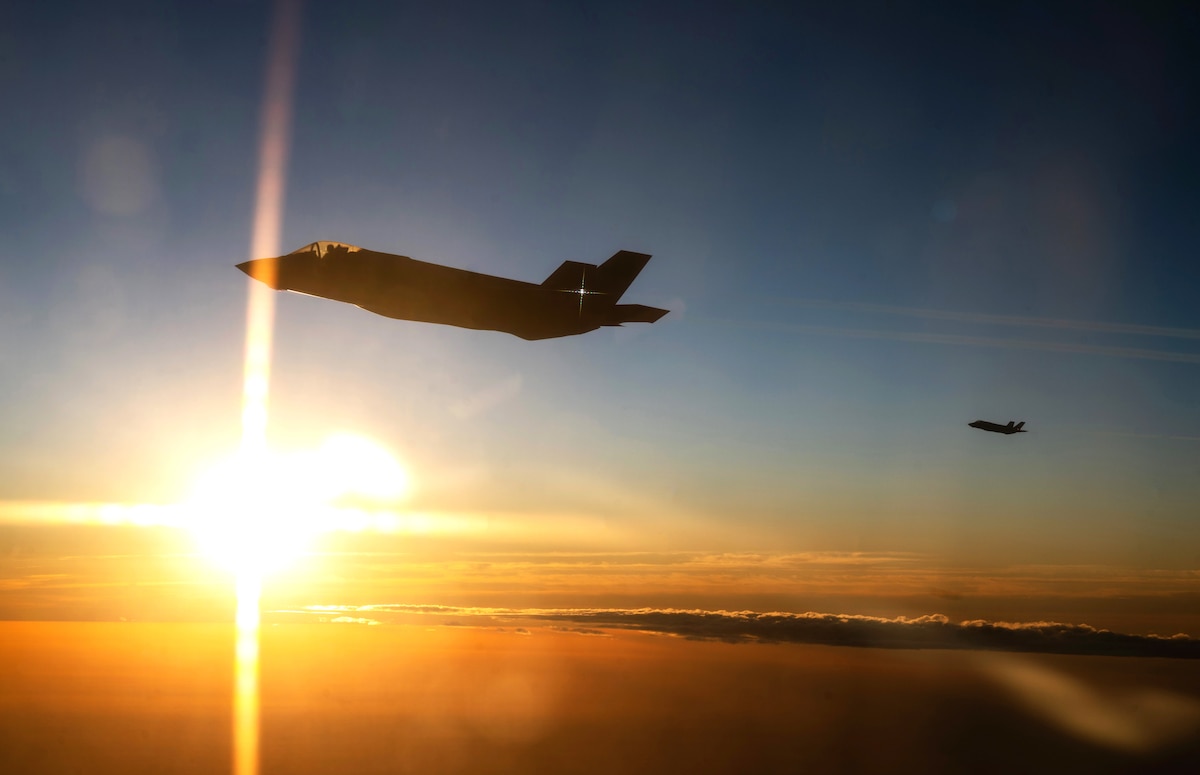 Two F-35 Lightning IIs assigned to the 4th Fighter Squadron, Hill Air Force Base, Utah, fly at sunset alongside a KC-46A Pegasus assigned to the 22nd Air Refueling Wing, McConnell Air Force Base, Kansas, during Exercise Bamboo Eagle 25-3 off the coast of California, Aug. 4, 2025. Bamboo Eagle 25-3 represents the evolving landscape of warfare as each iteration builds on the challenges of today and tomorrow, preparing forces to be ready regardless of the threat. (U.S. Air Force photo by Staff Sgt. Tryphena Mayhugh)