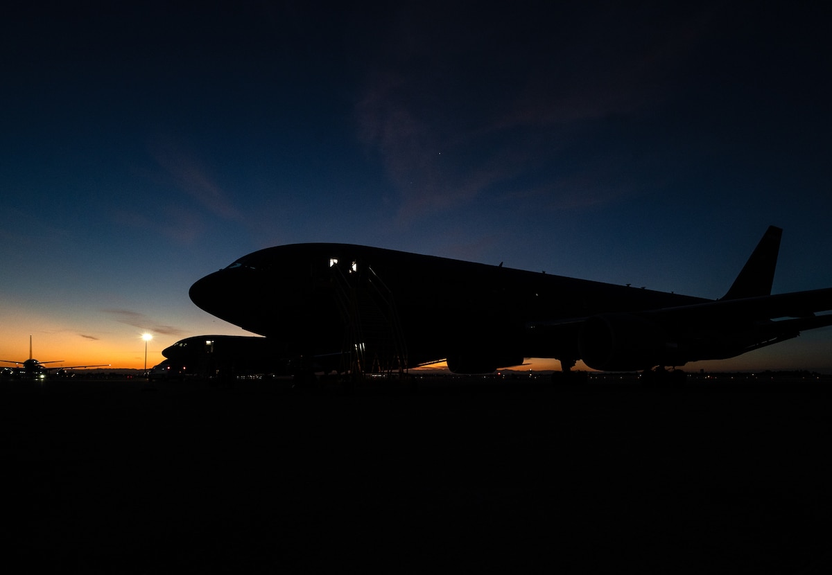 Multiple KC-46A Pegasus tankers are prepped for takeoff along the flight line during Exercise Bamboo Eagle 25-3 at Sacramento Mather Airport, California, Aug. 7, 2025. Bamboo Eagle 25-3 evolves previous BE iterations and provides an advanced and realistic training environment that prepares U.S. Air Forces as part of the joint force for the evolving demands of modern warfare. (U.S. Air Force photo by Staff Sgt. Tryphena Mayhugh)