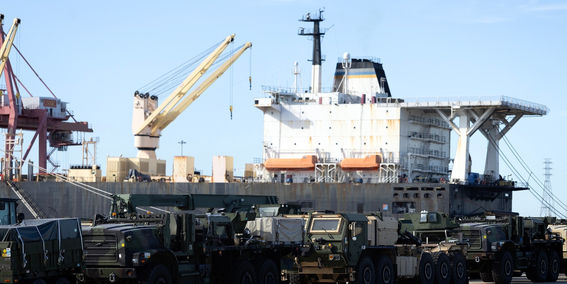 Military vehicles line a staging area Aug. 12, 2025, as Blount Island Command contractors offload the USNS PFC Dewayne T. Williams at Marine Corps Support Facility Blount Island in Florida.