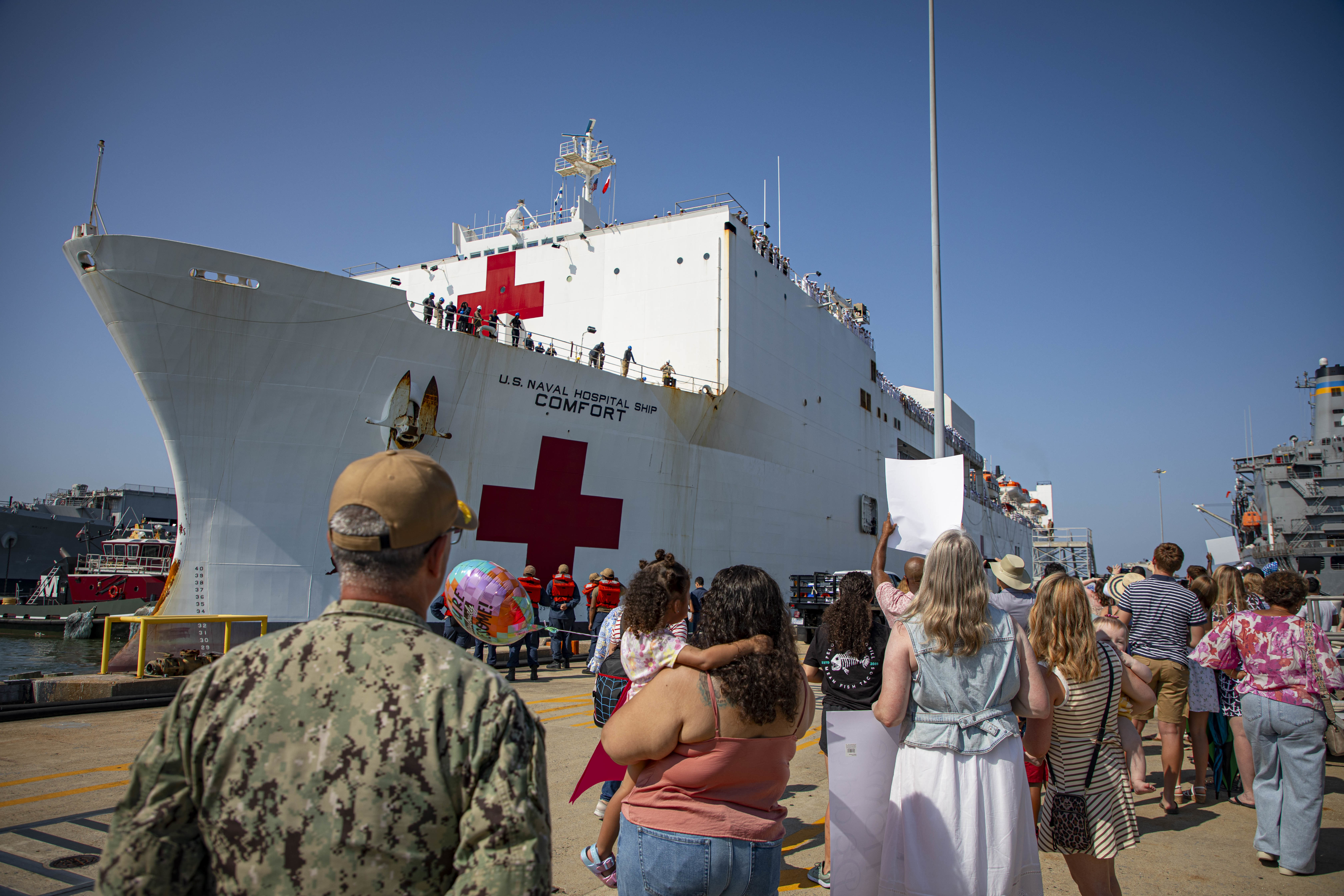 Rear Adm. Robert Hawkins, commander, Naval Medical Forces Atlantic (NMFL), and director, Defense Health Network (DHN) - Atlantic, observes as the Mercy-Class hospital ship USNS Comfort (T-AH 20), pulls into Naval Station Norfolk, Aug. 17, 2025. Comfort completed six mission visits to Grenada, Panama, Ecuador, Dominican Republic, Costa Rica, Trinidad and Tobago, providing direct care to thousands of patients.