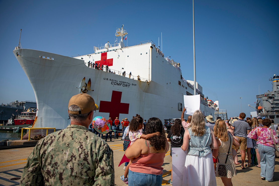 Rear Adm. Robert Hawkins, commander, Naval Medical Forces Atlantic (NMFL), and director, Defense Health Network (DHN) - Atlantic, observes as the Mercy-Class hospital ship USNS Comfort (T-AH 20), pulls into Naval Station Norfolk, Aug. 17, 2025. Comfort completed six mission visits to Grenada, Panama, Ecuador, Dominican Republic, Costa Rica, Trinidad and Tobago, providing direct care to thousands of patients.