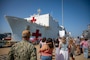 Rear Adm. Robert Hawkins, commander, Naval Medical Forces Atlantic (NMFL), and director, Defense Health Network (DHN) - Atlantic, observes as the Mercy-Class hospital ship USNS Comfort (T-AH 20), pulls into Naval Station Norfolk, Aug. 17, 2025. Comfort completed six mission visits to Grenada, Panama, Ecuador, Dominican Republic, Costa Rica, Trinidad and Tobago, providing direct care to thousands of patients.