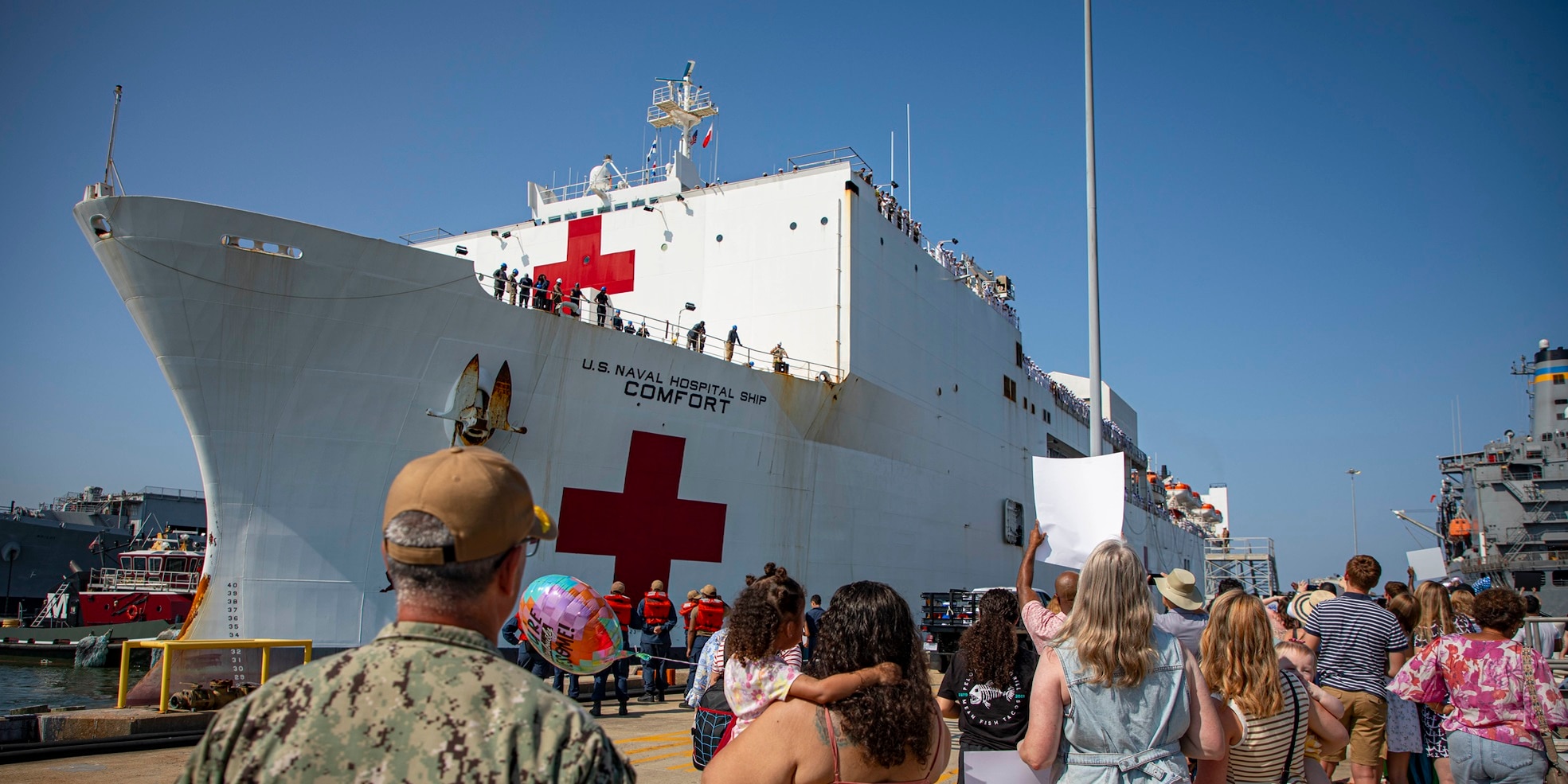 Rear Adm. Robert Hawkins, commander, Naval Medical Forces Atlantic (NMFL), and director, Defense Health Network (DHN) - Atlantic, observes as the Mercy-Class hospital ship USNS Comfort (T-AH 20), pulls into Naval Station Norfolk, Aug. 17, 2025. Comfort completed six mission visits to Grenada, Panama, Ecuador, Dominican Republic, Costa Rica, Trinidad and Tobago, providing direct care to thousands of patients.