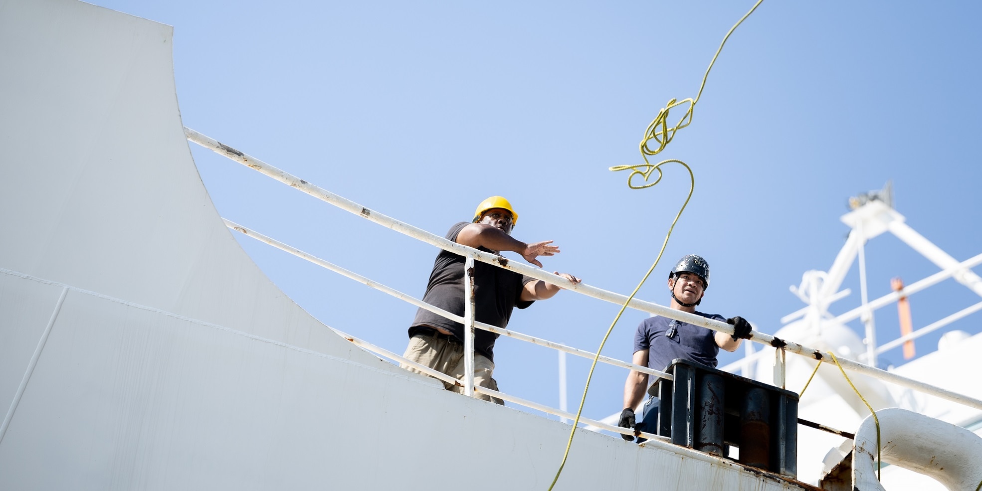 A Civil Service Mariner (CIVMAR) assigned to USNS Comfort (T-AH 20) throws a heaving line to the pier as they arrive back at Naval Station Norfolk after completing its summer deployment to the U.S. Southern Command area of operations as part of Continuing Promise 2025 Aug. 17, 2025. Comfort completed six mission visits to Grenada, Panama, Ecuador, Dominican Republic, Costa Rica, Trinidad and Tobago, providing direct care to thousands of patients.