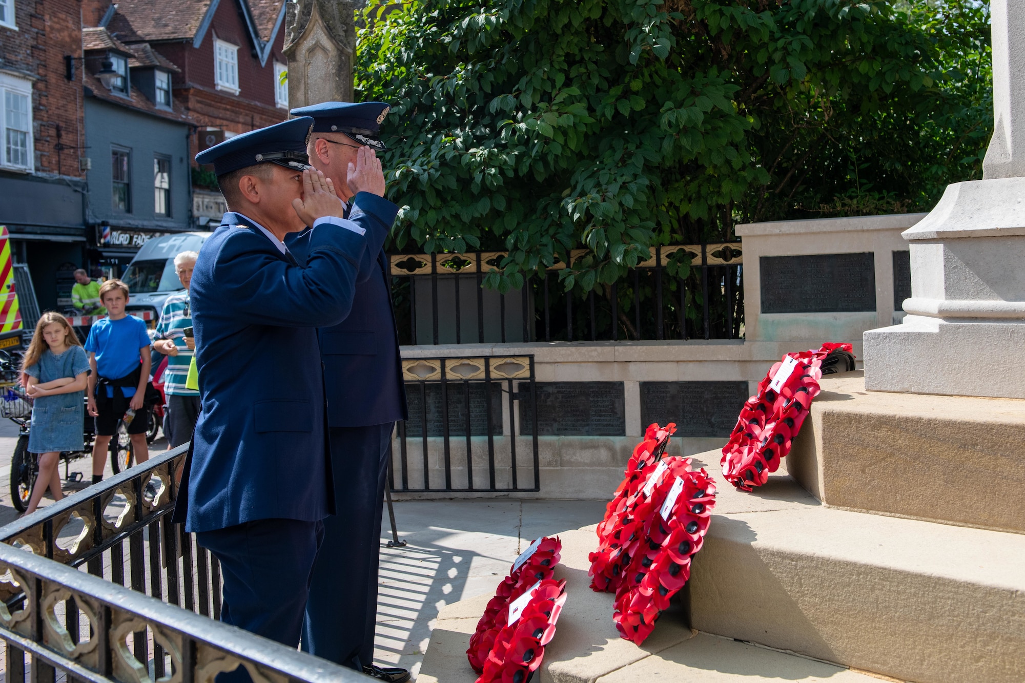 U.S. Air Force leaders from the 501st Combat Support Wing salute after laying a wreath during the 80th anniversary Victory over Japan Day ceremony