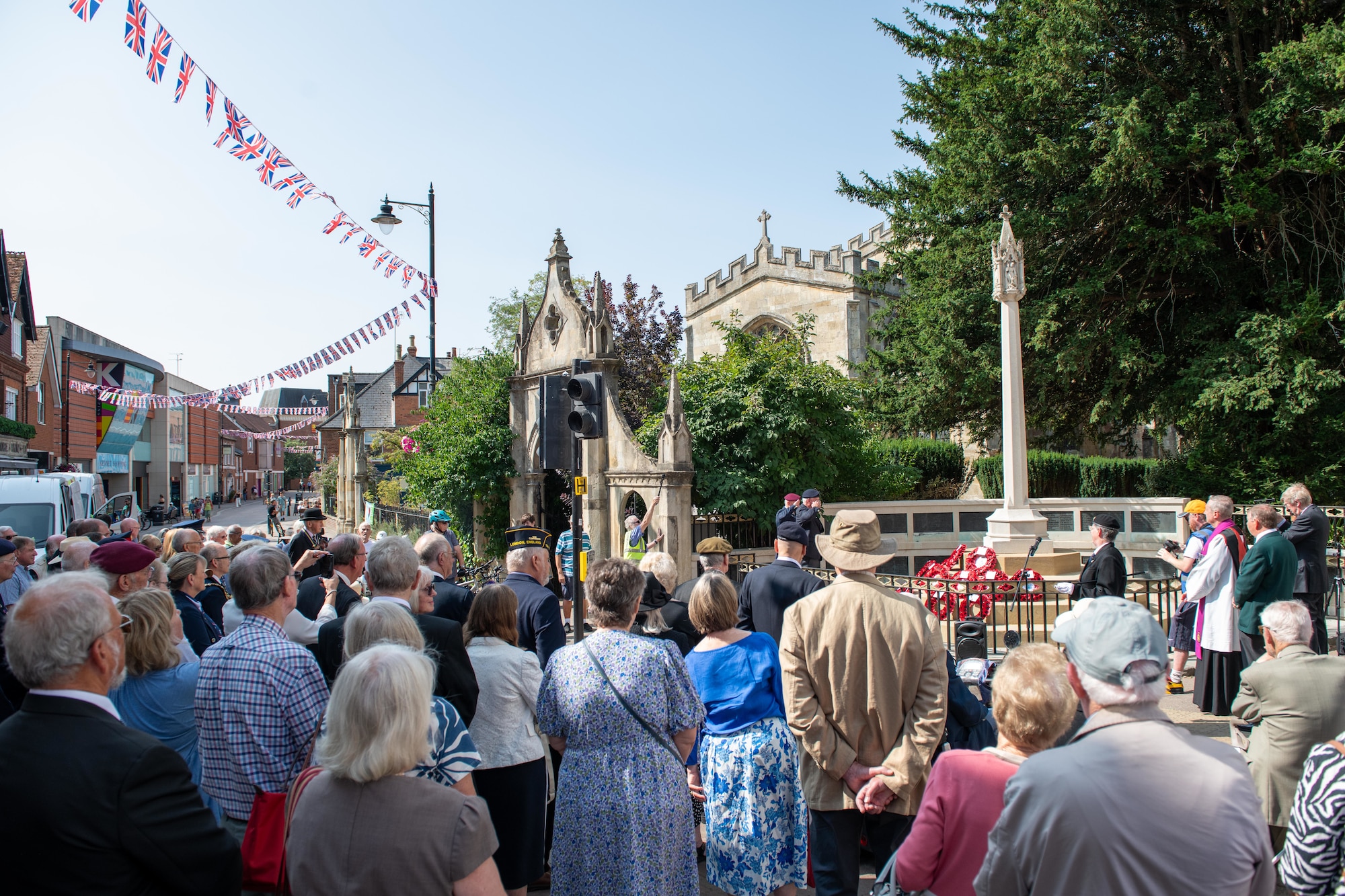 Community members gather at the Newbury War Memorial during the 80th anniversary Victory over Japan Day ceremony