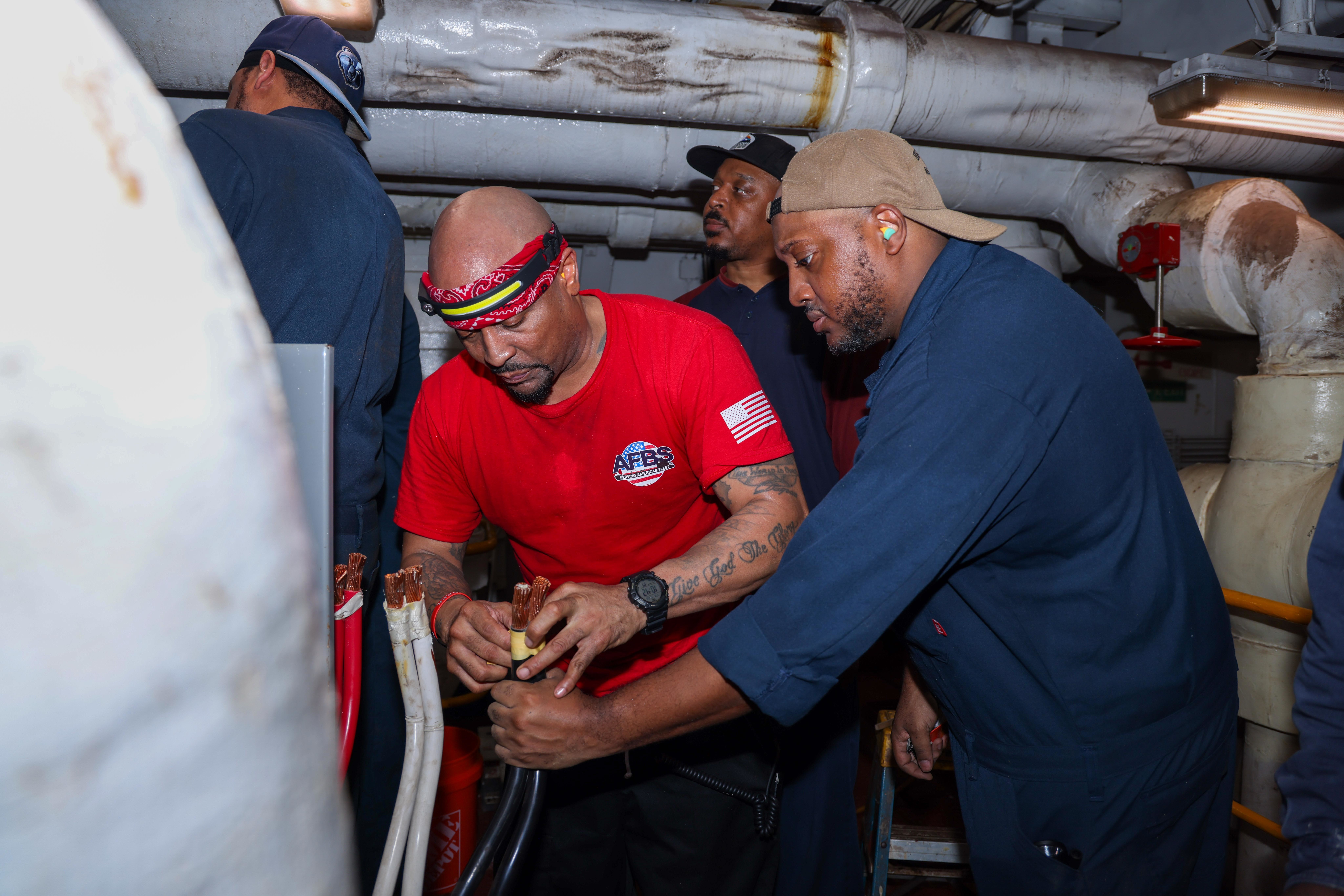 Civilian Mariners assigned to Military Sealift Command aboard the Mercy-class hospital ship USNS Comfort (T-AH 20) perform maintenance on the air conditioning system during Continuing Promise 2025, July 23, 2025. Continuing Promise 2025 is the 16th iteration of the U.S. 4th Fleet/U.S. Naval Forces Southern Command-led mission since 2007, which aims to foster goodwill, strengthen existing partnerships with partner nations, and form new partnerships between host nations, non-federal entities, and international organizations.