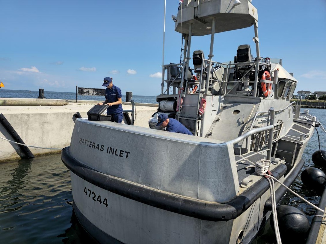 Members of U.S. Coast Guard Station Hatteras Inlet inspect equipment aboard a 47ft Motor Life Boat at Cape Hatteras, NC, Aug 19, 2025. Coast Guard units and crews along the East Coast strategically moved personnel, equipment, and resources in anticipation of Hurricane Erin. (U.S. Coast Guard Courtesy Photo)