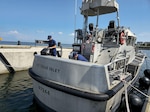 Members of U.S. Coast Guard Station Hatteras Inlet inspect equipment aboard a 47ft Motor Life Boat at Cape Hatteras, NC, Aug 19, 2025. Coast Guard units and crews along the East Coast strategically moved personnel, equipment, and resources in anticipation of Hurricane Erin. (U.S. Coast Guard Courtesy Photo)