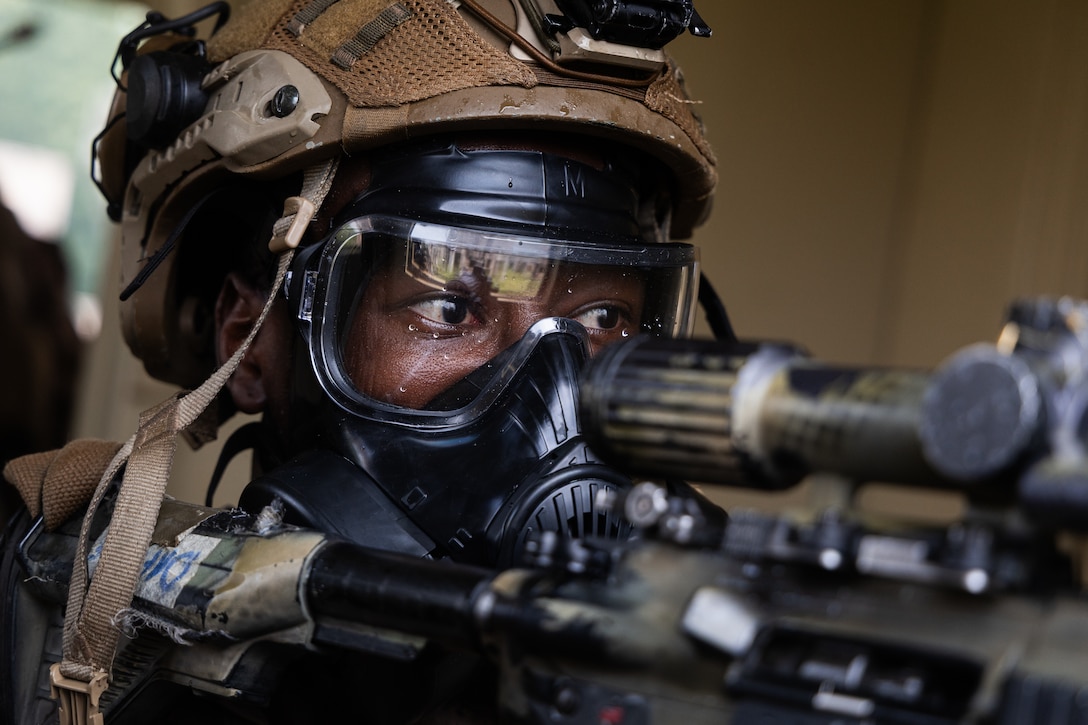 U.S. Marine Corps Lance Cpl. Kendy Dafinice, a rifleman with Golf Company, 2nd Battalion, 2nd Marine Regiment provides security during urban operations training at Marine Corps Base Quantico, Virginia, July 31, 2025. 2nd Battalion, 2nd Marines, the ground combat element of the Special Purpose Marine Air-Ground Task Force-Alert Contingency MAGTF, and Combat Logistics Battalion 22, the logistics combat element of the SPMAGTF-ACM, conducted a deployment for training in order to maintain operational readiness and enhance overall unit cohesion. (U.S. Marine Corps photo by Cpl. Osmar VasquezHernandez)