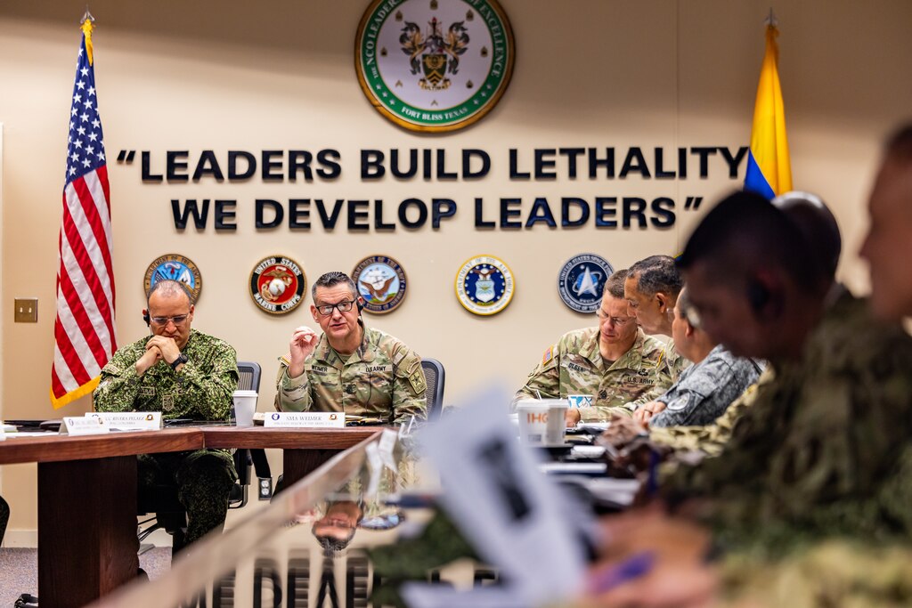 U.S. Army Sgt. Maj. of the Army Michael Weimer, center, speaks to Programa Integral para Suboficiales de Alta Jerarquía (PISAJ) 21 participants and facilitators from the U.S. and Colombian militaries about the roles and responsibilities of senior enlisted leaders at the U.S. Army Sergeants Major Academy at Fort Bliss, Texas, Aug. 18, 2025. PISAJ is a biannual, partner nation-funded initiative aligned with U.S. Southern Command’s Theater Campaign Plan and directly supports the Colombian army’s transformation to align its noncommissioned officer corps with globally recognized standards. (U.S. Army photo by Staff Sgt. Joshua Taeckens)