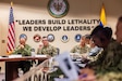 U.S. Army Sgt. Maj. of the Army Michael Weimer, center, speaks to Programa Integral para Suboficiales de Alta Jerarquía (PISAJ) 21 participants and facilitators from the U.S. and Colombian militaries about the roles and responsibilities of senior enlisted leaders at the U.S. Army Sergeants Major Academy at Fort Bliss, Texas, Aug. 18, 2025. PISAJ is a biannual, partner nation-funded initiative aligned with U.S. Southern Command’s Theater Campaign Plan and directly supports the Colombian army’s transformation to align its noncommissioned officer corps with globally recognized standards. (U.S. Army photo by Staff Sgt. Joshua Taeckens)