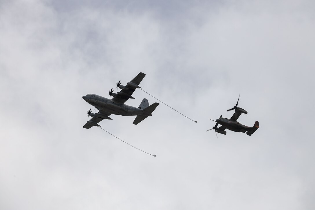 A U.S. Marine Corps KC-130J assigned to Marine Aerial Refueler Transport Squadron (VMGR) 153, Marine Aircraft Group (MAG) 24, 1st Marine Aircraft Wing (MAW), demonstrates an air to air refueling with an MV-22B Osprey assigned to Marine Medium Tiltrotor Squadron (VMM) 363, MAG-24, 1st MAW, during the 2025 Marine Corps Base Hawaii (MCBH) Kaneohe Bay Air Show, Aug. 9, 2025. The Kaneohe Bay Air Show provides an opportunity to showcase the aircraft, equipment and capabilities of the armed forces in the Indo-Pacific region to the local community. The air show, which contained aerial performances, static displays, demonstrations and vendors, was designed to celebrate MCBH’s longstanding relationship with the local community. (U.S. Marine Corps photo by Cpl. Anabelle Reed-O’Brien)