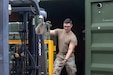 U.S. Army Sgt. Adam Garceau, a biomedical equipment specialist assigned to the 308th Medical Logistics Company, 145th Multifunctional  Medical Battalion, 2nd Medical Brigade, helps unload a forklift at Sagami Supply Depot in Sagamihara, Japan, July 14, 2025. Operation Patriot Press is a large-scale, multi-component logistics exercise that provides realistic training opportunities for the US Army Reserve, National Guard, and active-duty components to enhance their logistical acumen and readiness. (U.S. Army photo by Staff Sgt. Ian Valley)
