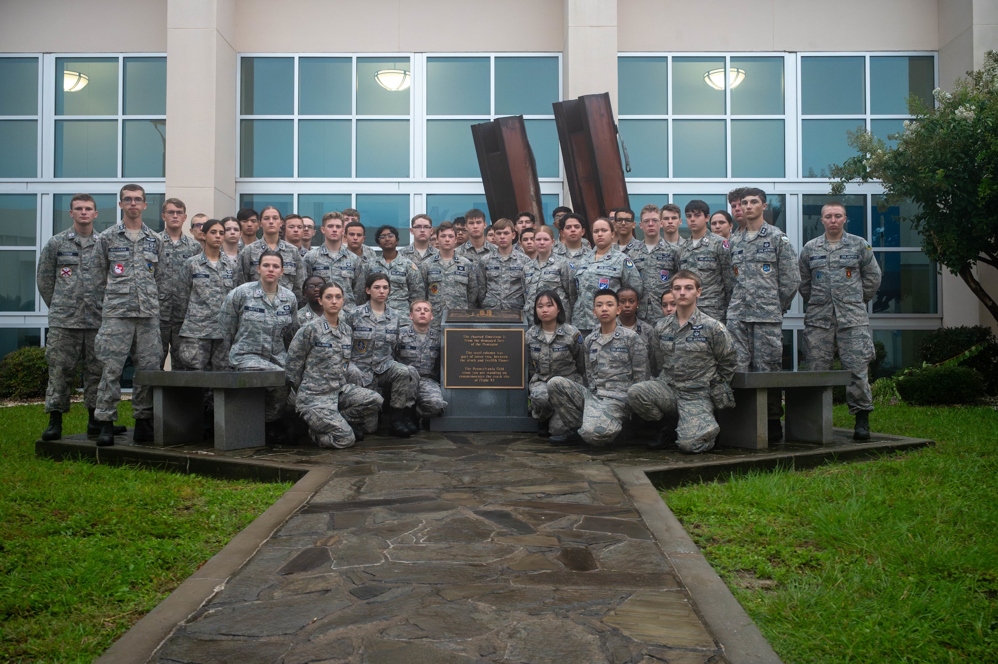 Cadets in uniform pose for a group photo.