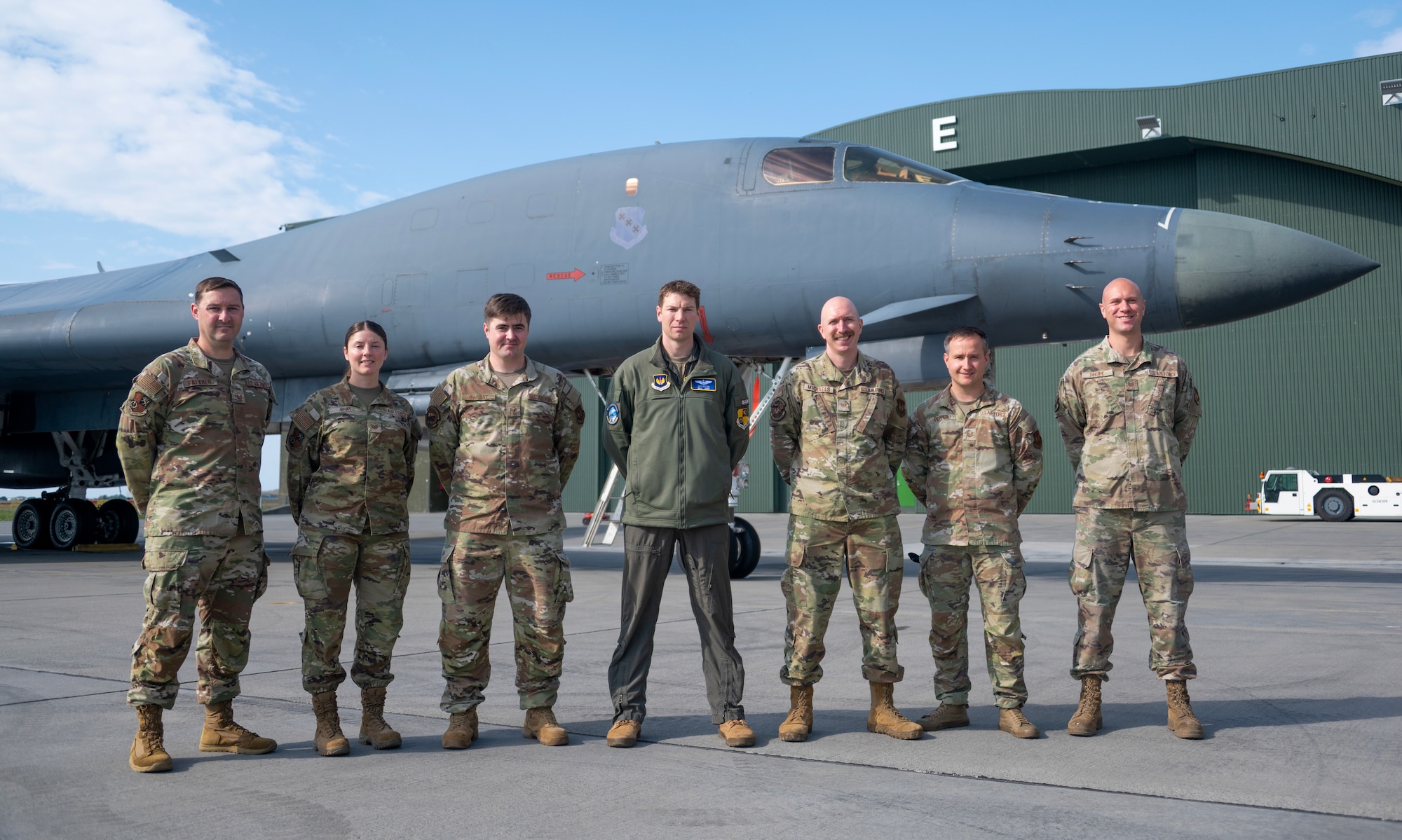 An airman walks around a plane