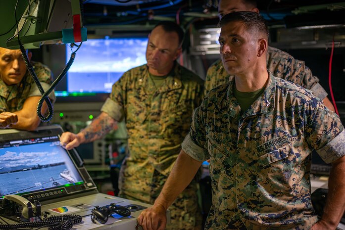 Col. Gabriel L. Diana, 3rd Marine Littoral Regiment commanding officer, right, and staff tour the Virginia-class fast-attack submarine USS Vermont (SSN 792) on Joint Base Pearl Harbor-Hickam, Aug. 14, 2025.