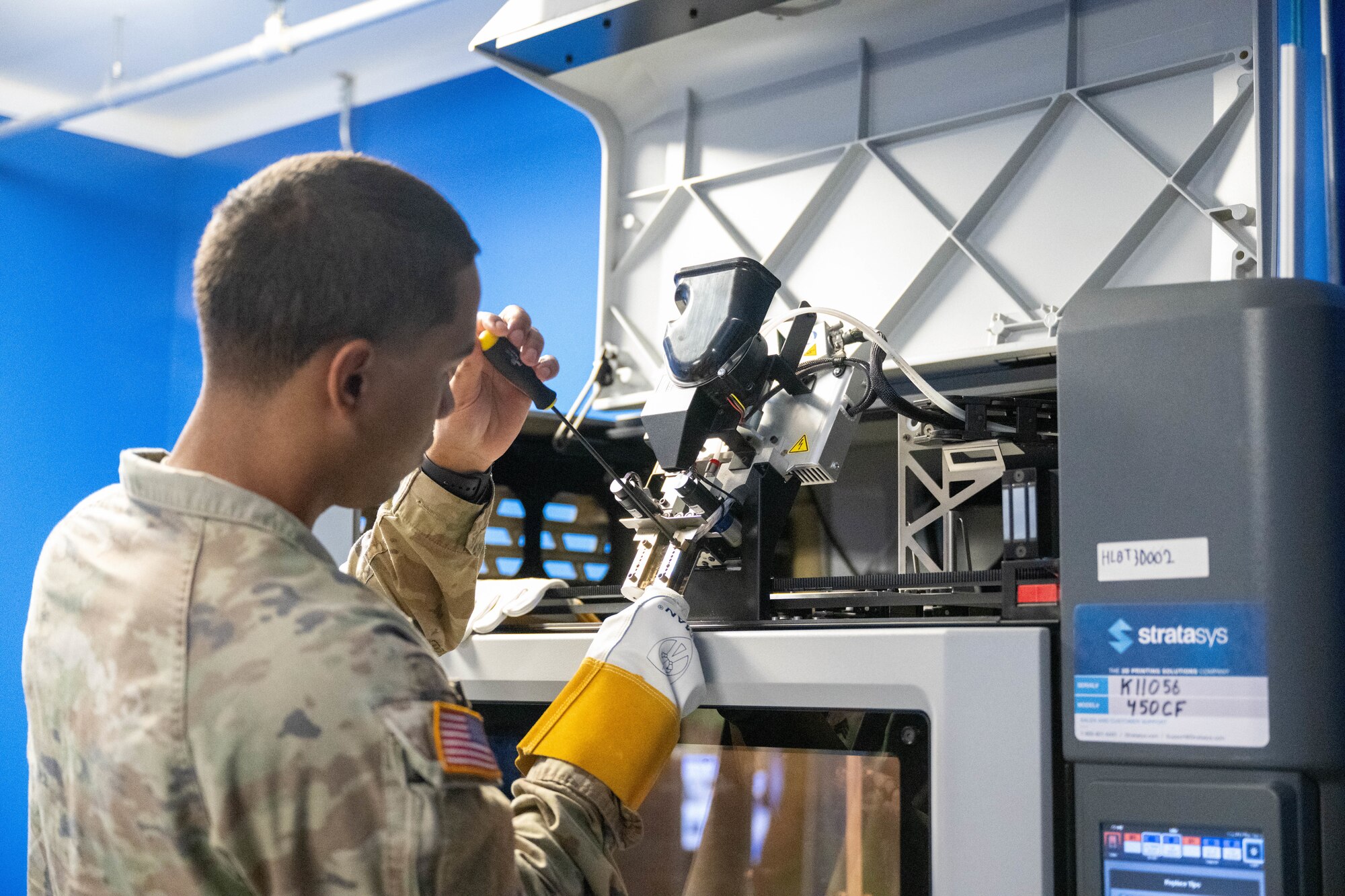 A U.S. Army soldier changes a module on the 3D printer as part of the 3D printing operator course on Joint Base Pearl Harbor-Hickam, Hawaii.