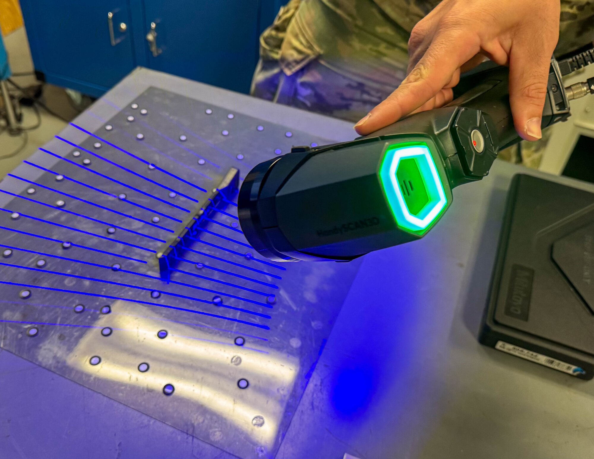 An Airmen scans a tool into the computer in order to 3D print a copy on Joint Base Pearl Harbor-Hickam, Hawaii.